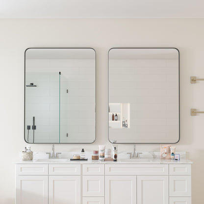 30x40 inch black mirror mounted on bathroom wall
